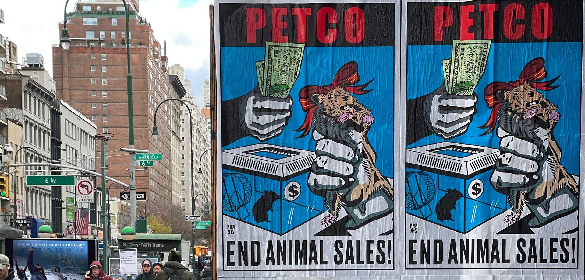 Posters that say "Petco End Animal Sales!"